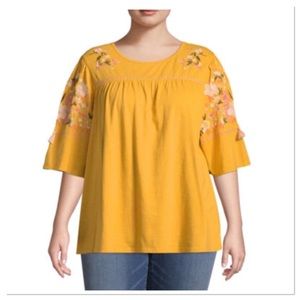 Gold shirt with embroidered flowers